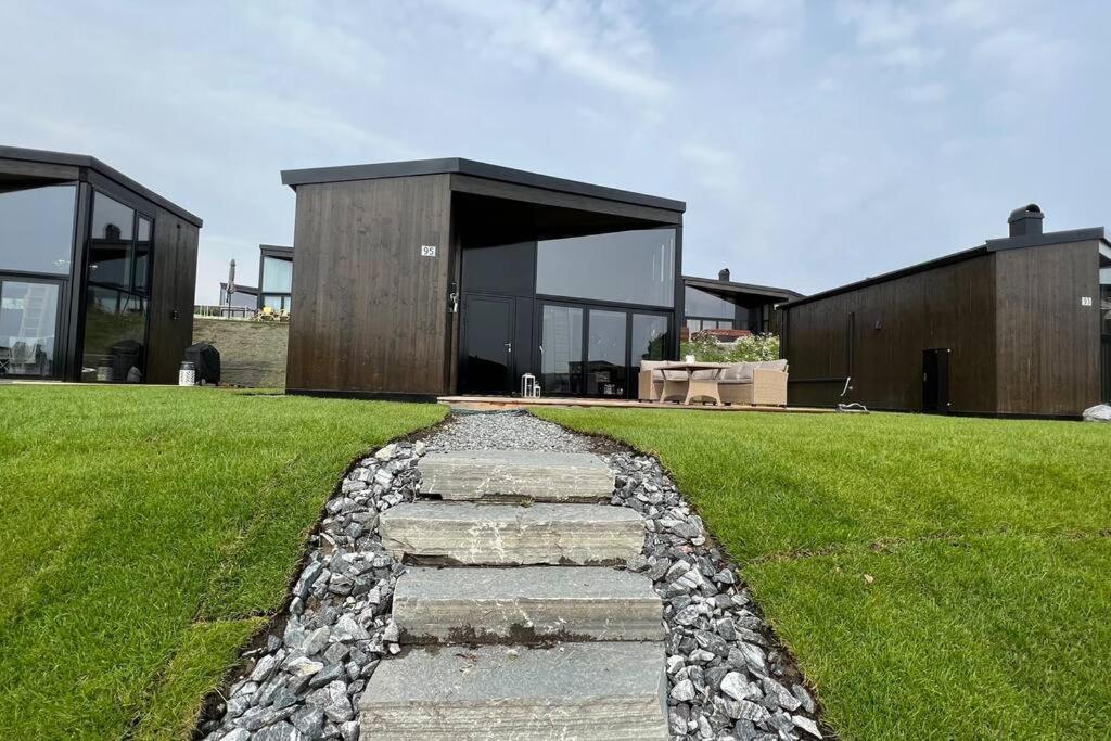 Attraktiv & Smart Funkishytte Pa Nes Strandhager. Holiday home